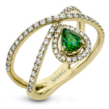 This 18k white gold ring has a lovely looping design which hold a .31 ctw emerald gemstone.