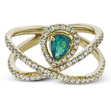 This 18k white gold ring has a lovely looping design which hold a .31 ctw emerald gemstone.