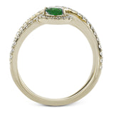 This 18k white gold ring has a lovely looping design which hold a .31 ctw emerald gemstone.