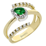 This right hand ring wraps the finger in bands of lustrous yellow gold, outlined by 2 rows of diamonds 0.28 ctw. and has a pear-shaped Emerald 0.28 ct. center, set in a white gold diamond halo