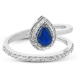 This spiraling 18k white gold ring features a .54 ct pear shaped blue sapphire accented by .33 ctw of white diamonds.