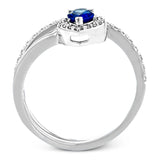 This spiraling 18k white gold ring features a .54 ct pear shaped blue sapphire accented by .33 ctw of white diamonds.