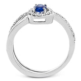 An oval shaped blue sapphire is the star of this 18k white gold ring, set with .32 ctw of white diamonds.