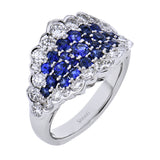 A stunning statement, this right hand ring features .87cttw pariba tourmaline surrounded by 1.35cttw diamonds.