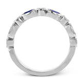 This lovely 18k white gold band is perfect for stacking but can also stand on its own. Blue sapphires are paired with .15 ctw of diamonds.