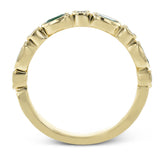 This lovely 18k yellow gold band is perfect for stacking but can also stand on its own. Beautiful green emeralds are paired with .15 ctw of diamonds.