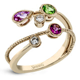 This 18k rose gold spiral ring is sprinkled with colorful gemstones embodying the spirit of springtime, including round white diamonds, a green tsavorite garnet, a pink sapphire and a spinel.