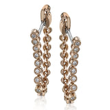 These versatile earrings can be worn in two ways, transforming from a line of diamonds into soft hoops. They're perfect for going from day to night.