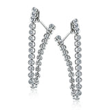 These versatile earrings can be worn in two ways, transforming from a line of diamonds into soft hoops. They're perfect for going from day to night.