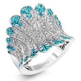 The contemporary design of this white gold ring is elevated by 1.10 ctw of white diamonds and .65 Paraiba tourmaline stones in an elegant pave setting.