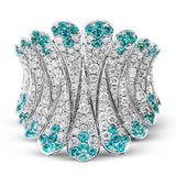 The contemporary design of this white gold ring is elevated by 1.10 ctw of white diamonds and .65 Paraiba tourmaline stones in an elegant pave setting.