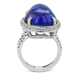 This 18k white gold ring is set with a one-of-a-kind 27.24 ct tanzanite cabochon accented by .97 ctw of white diamonds.