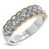 This exquisite band is perfect as an anniversary band or as a right hand ring, featuring 1.09 ctw of princess cut diamonds with touches of yellow gold along the outside.