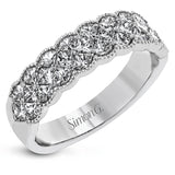 This exquisite band is perfect as an anniversary band or as a right hand ring, featuring 1.09 ctw of princess cut diamonds with touches of yellow gold along the outside.