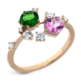 The distinctive, organic design of this 18k rose gold ring is set with a .51 ct lavender pink spinel stone and a .42 ct green tsavorite garnet.