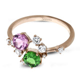 The distinctive, organic design of this 18k rose gold ring is set with a .51 ct lavender pink spinel stone and a .42 ct green tsavorite garnet.