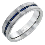 A striking men's wedding band in 14K white gold has a brushed finish and a row of sapphires 0.60 ctw., sprinkled with white diamonds 0.10 ctw.