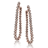 These versatile earrings can be worn in two ways, transforming from a line of diamonds into soft hoops. The perfect earring to move from day to night.