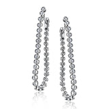 These versatile earrings can be worn in two ways, transforming from a line of diamonds into soft hoops. The perfect earring to move from day to night.