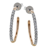 The playful contrast of white and rose gold is enhanced by .50 ctw of white diamonds in these chaming earrings