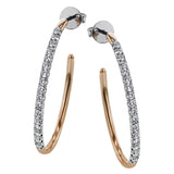 These beautiful earrings feature .75 ctw of white diamonds set in 18K rose gold.
