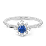 This 18k white gold ring adds the perfect pop of bright color to any outfit.