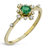 This charming 18k yellow gold ring is perfect for stacking and contains a .35 ct center tsavorite stone and .13 ctw accent diamonds.