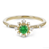 This charming 18k yellow gold ring is perfect for stacking and contains a .35 ct center tsavorite stone and .13 ctw accent diamonds.