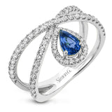 This 18k white gold ring has a lovely looping design which hold a .42 ctw sapphire gemstone.