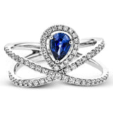 This 18k white gold ring has a lovely looping design which hold a .42 ctw sapphire gemstone.