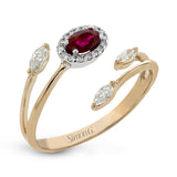 This delightful 18k white and rose gold ring is set with one .29 ctw spinel and .18 ctw of white marquise and .06ctw of white round diamonds in its bypass design