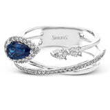 This modern 18k white gold ring features a crossover design set with a .42 ct blue sapphire, .12 ctw of pear shaped diamonds, and .20 ctw of round diamonds.