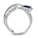 This modern 18k white gold ring features a crossover design set with a .42 ct blue sapphire, .12 ctw of pear shaped diamonds, and .20 ctw of round diamonds.