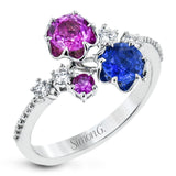 Crafted in 18k white gold, this distinctive fashion ring showcases multiple sapphires in beautiful tones of blue and pink.