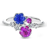 Crafted in 18k white gold, this distinctive fashion ring showcases multiple sapphires in beautiful tones of blue and pink.