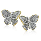 These butterfly stud earrings are set with .10 ctw of white diamonds and feature both gray and yellow gold.