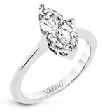 This solitaire ring design is built to perfectly showcase a beautiful marquise shaped center stone.