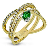 This modern right hand ring crafted in 18K gold features .61cttw white diamonds and a .39ct emerald.