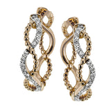 A twisting design of 18k rose and white gold are an ideal size of everyday wear, while .18 ctw of diamonds add the perfect touch of sparkle.