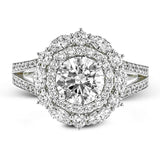 Rows of diamonds create a stunning effect in this 18k white gold engagement ring made for a round diamond. A total of .65 ctw of round diamonds and .35 ctw marquise diamonds surround the center stone.