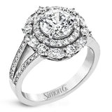 Rows of diamonds create a stunning effect in this 18k white gold engagement ring made for a round diamond. A total of .65 ctw of round diamonds and .35 ctw marquise diamonds surround the center stone.