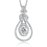 18k white gold twists and turns around itself in this oval shaped pendant, set with .29 ctw of white diamonds and an oval shaped center stone.