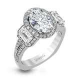 This impressive white gold ring features .43 ctw emerald cut side diamonds and is accented with .38 ctw round cut diamonds.