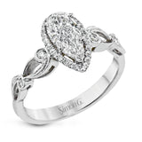 Reflecting a lovely romantic design, this white gold classic engagement ring features .16 ctw round cut white diamond accents.