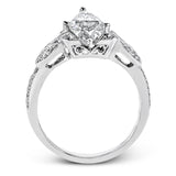 This amazing 18k white gold engagement ring features vintage-inspired design elements set with .28 ctw of white diamonds.
