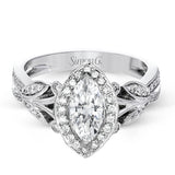 This amazing 18k white gold engagement ring features vintage-inspired design elements set with .28 ctw of white diamonds.