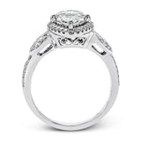 This amazing 18k white gold engagement ring features vintage-inspired design elements set with .28 ctw of white diamonds.
