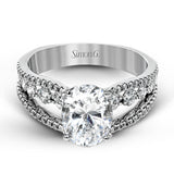 The lovely vintage style of this white gold engagement ring is further enhanced by .91 ctw of shimmering round cut diamonds.
