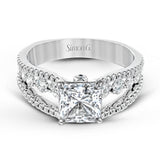 The lovely vintage style of this white gold engagement ring is further enhanced by .91 ctw of shimmering round cut diamonds.