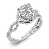 Classic with a modern twist, this white gold engagement ring features .50 ctw of sparkling white diamonds in a dramatic openwork design.